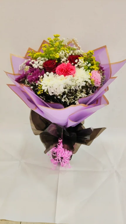 Fresh flower Chrysatimum and rose aster yellow and carnation bouquet