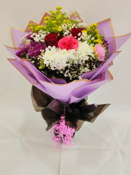 Fresh flower Chrysatimum and rose aster yellow and carnation bouquet