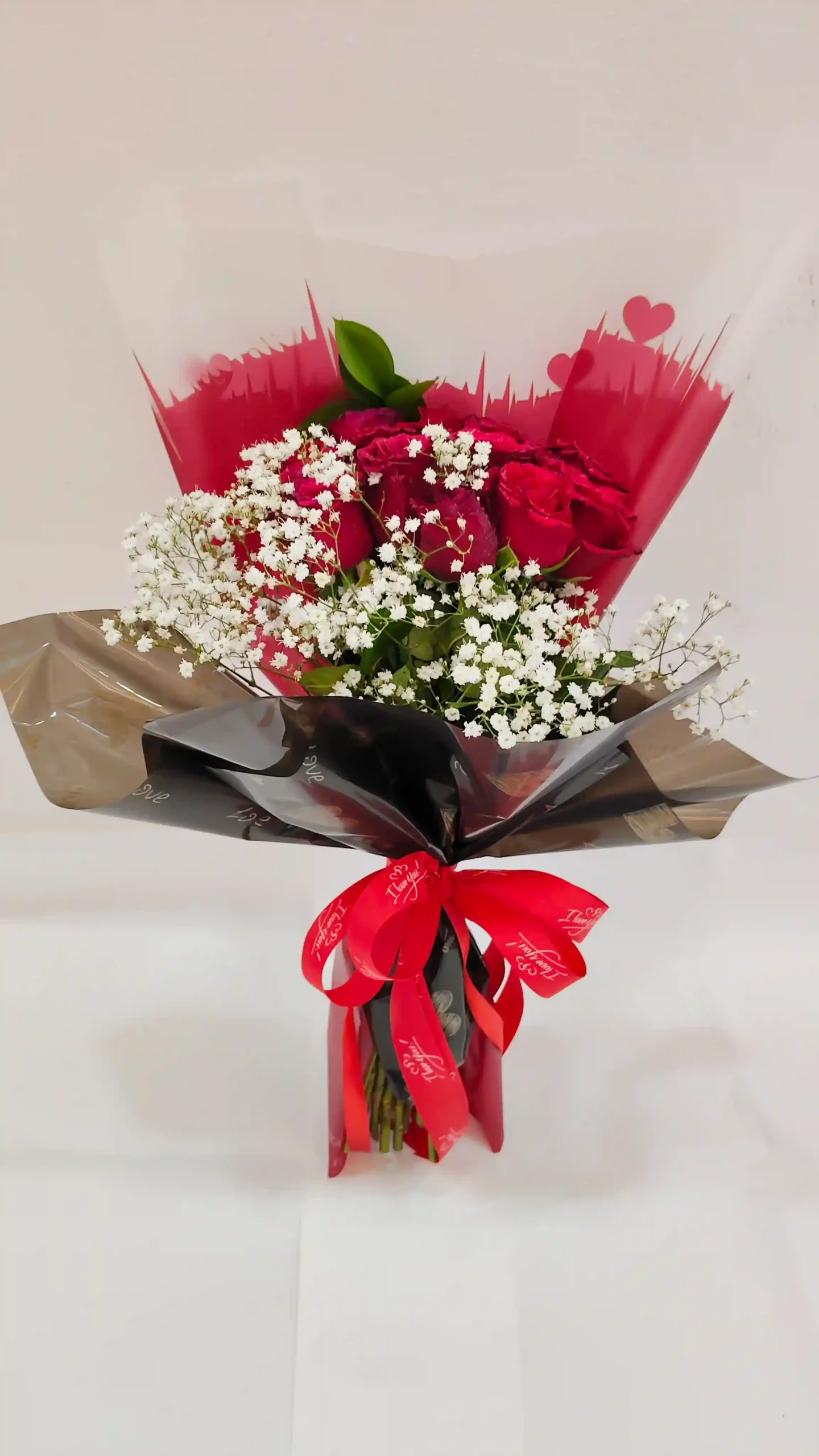 Hand bouquet red rose and w .AED.100.