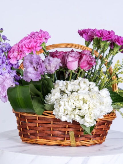 Mathiola purple and rose and carnetion purple hidrengia and soled aster basket arrangement
